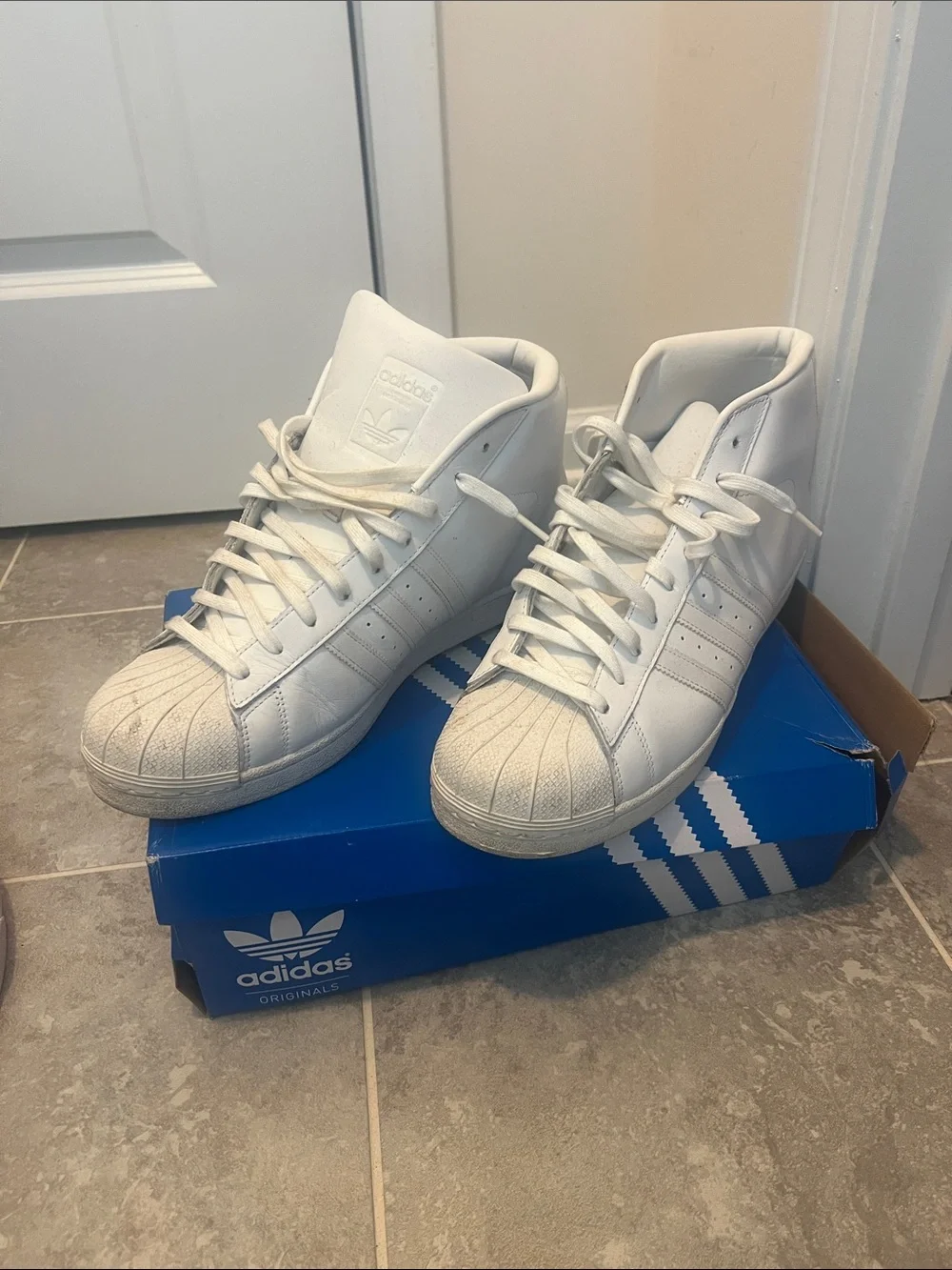 adidas Men’s White High-Top Shell-Toe Sneakers with Blue Box Accent